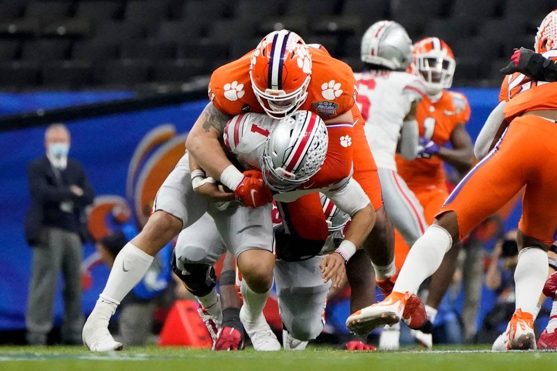 FILE - Ohio State quarterback Justin Fields is sacked by Clemson defensive lineman Bryan Bresee during the second half of the Sugar Bowl NCAA college football game in New Orleans, Jan. 1, 2021. Bresee was named to the Associated Press preseason All-America team, Monday, Aug. 22, 2022. (AP Photo/Gerald Herbert, File) Gerald Herbert/AP