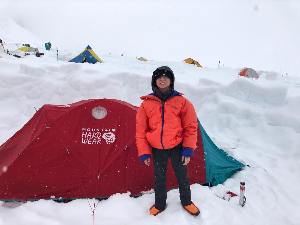 Mills Weinstein, who was 12 years old last summer, stands outside his tent at the 14,000-foot base camp on Denali. Mills and his father, Scott, have been attempting to reach the natural high point in all 50 states. All that remains now is Alaska and Denali. They came within about 3,000 feet of the 20,310-foot summit on this trip, but had to end the attempt when Scott injured his back.