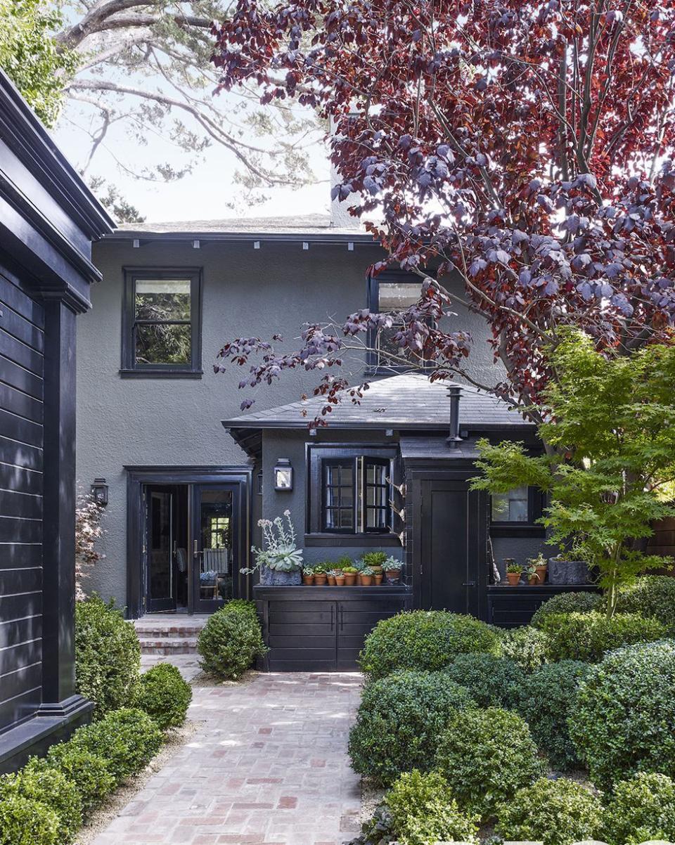 a house with a tree in the front