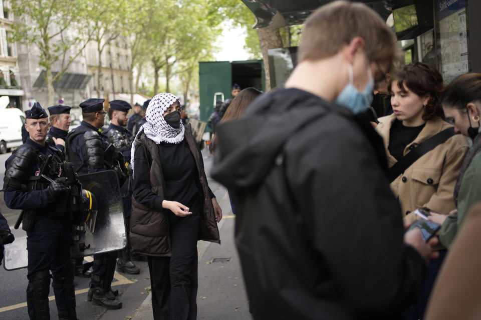Students gather near Sciences Po university Friday, May 3, 2024 in Paris. French police peacefully evacuated dozens of students from a building of the Paris Institute of Political Studies, known as Sciences Po, who had gathered there in support of Palestinians, echoing similar encampments and solidarity demonstrations across the United States. (AP Photo/Christophe Ena)