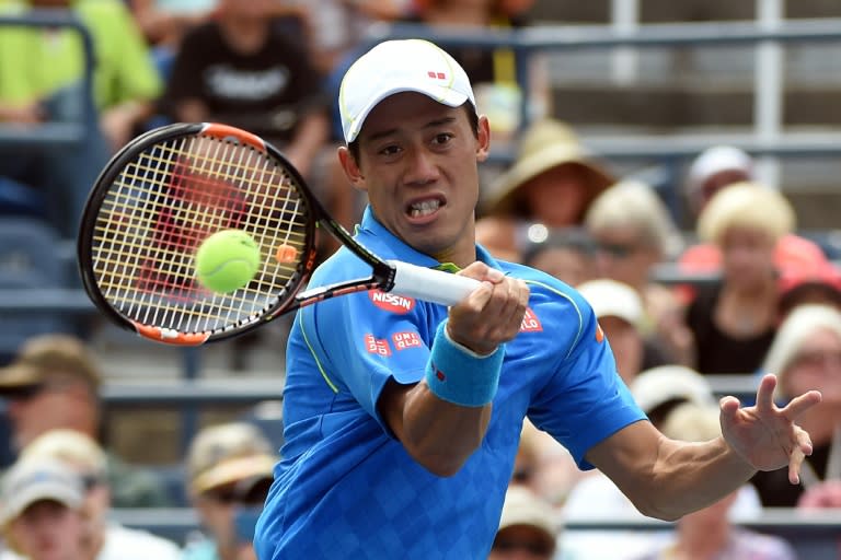 Japan's Kei Nishikori returns to France's Benoit Paire during their US Open men's singles match in New York on August 31, 2015