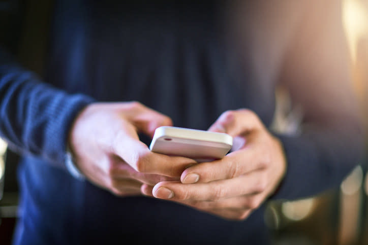 A man using a smartphone.