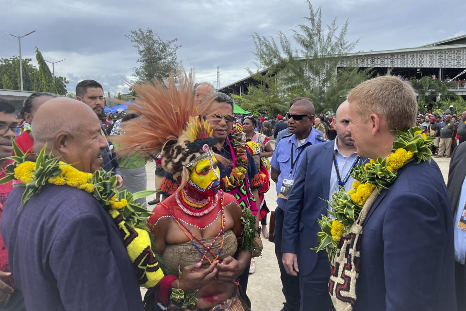 New Zealand Prime Minister Chris Hipkins, right, visits at Gordon's Market in Port Moresby, Papua New Guinea, Monday, May 22, 2023. Hipkins met with U.S. Secretary of State Antony Blinken who traveled in President Joe Biden's place. (AP Photo/Nick Perry)