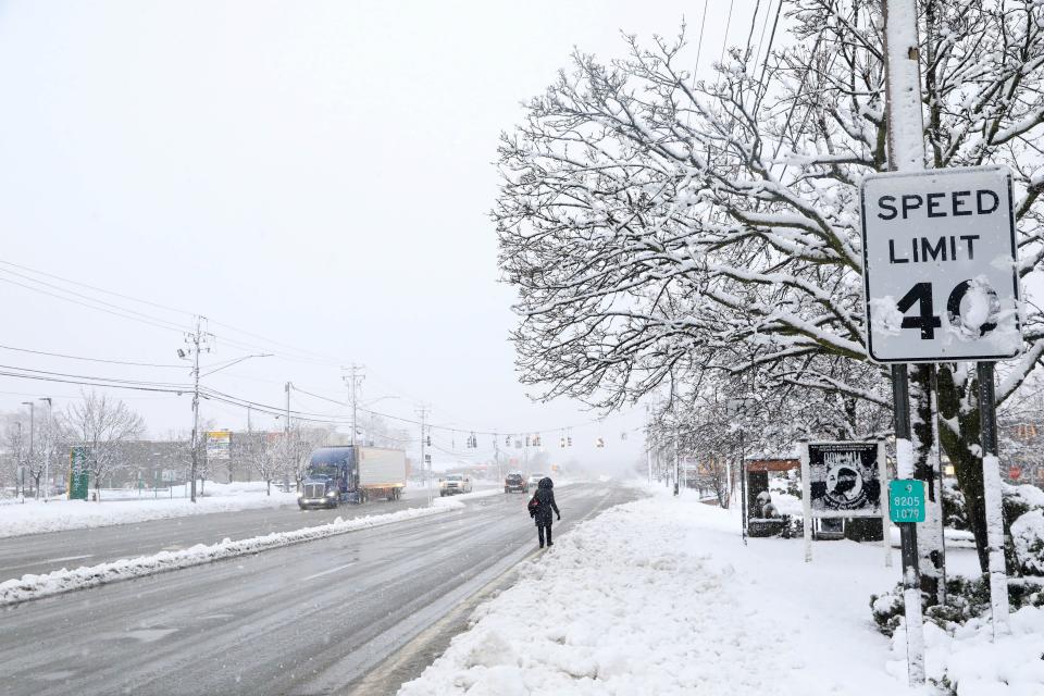 Pedestrians and traffic travel on Route 9 in the village of Wappingers Falls on March 14, 2023.