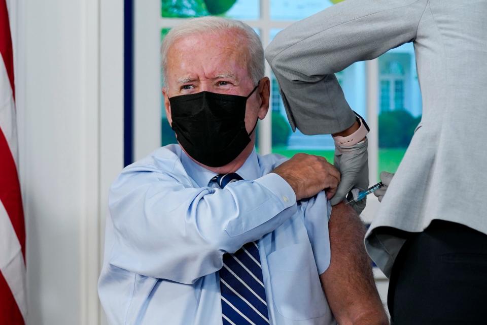 President Joe Biden receives a COVID-19 booster shot in the South Court Auditorium on the White House campus Monday, Sept. 27, 2021.