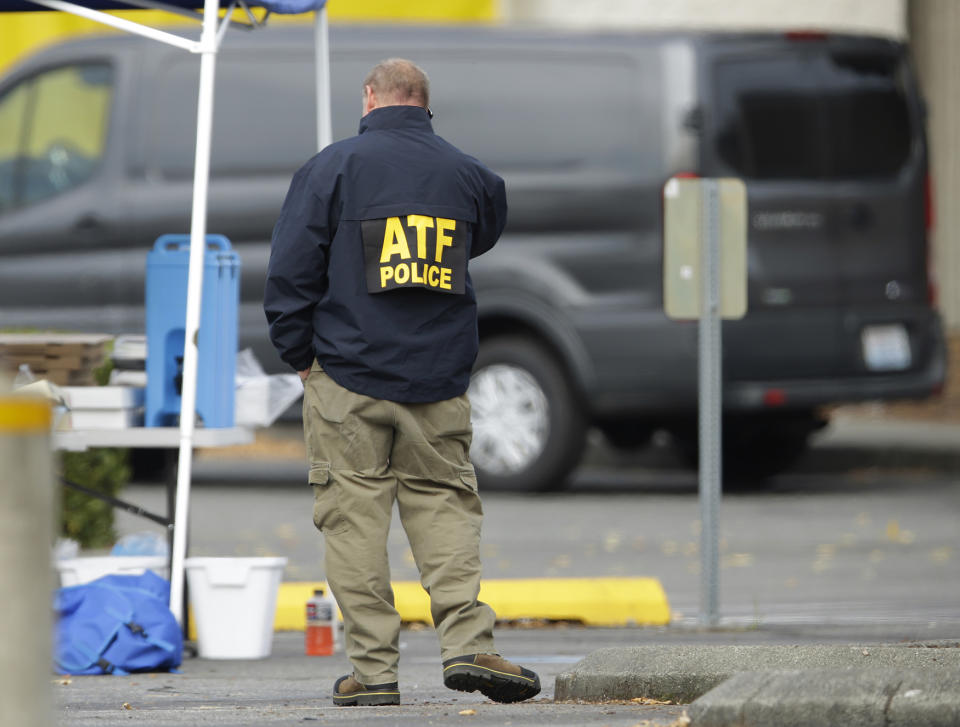 <p>A man wearing a jacket from the United States Department of Justice’s Alcohol, Tobacco, and Firearms bureau talks on a phone, Saturday, Sept. 24, 2016, at the Cascade Mall in Burlington, Wash. On Friday night, a man with a rifle opened fire in a Macy’s Department Store at the mall, killing several people. (AP Photo/Ted S. Warren) </p>