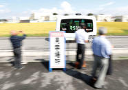 Robot Shuttle, a driver-less, self driving bus, developed by Japan's internet commerce and mobile games provider DeNA Co., drives past during an experimental trial with a self-driving bus in a community in Nishikata town, Tochigi Prefecture, Japan September 8, 2017. REUTERS/Issei Kato
