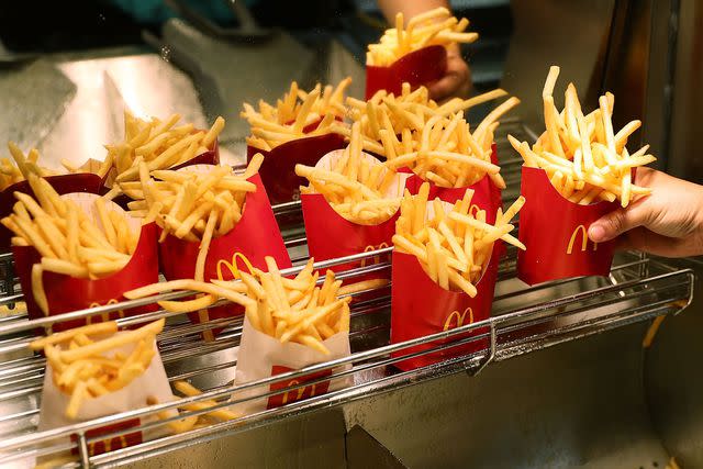 <p>Joe Raedle/Getty </p> McDonald's offers a deal for free fries on its app.