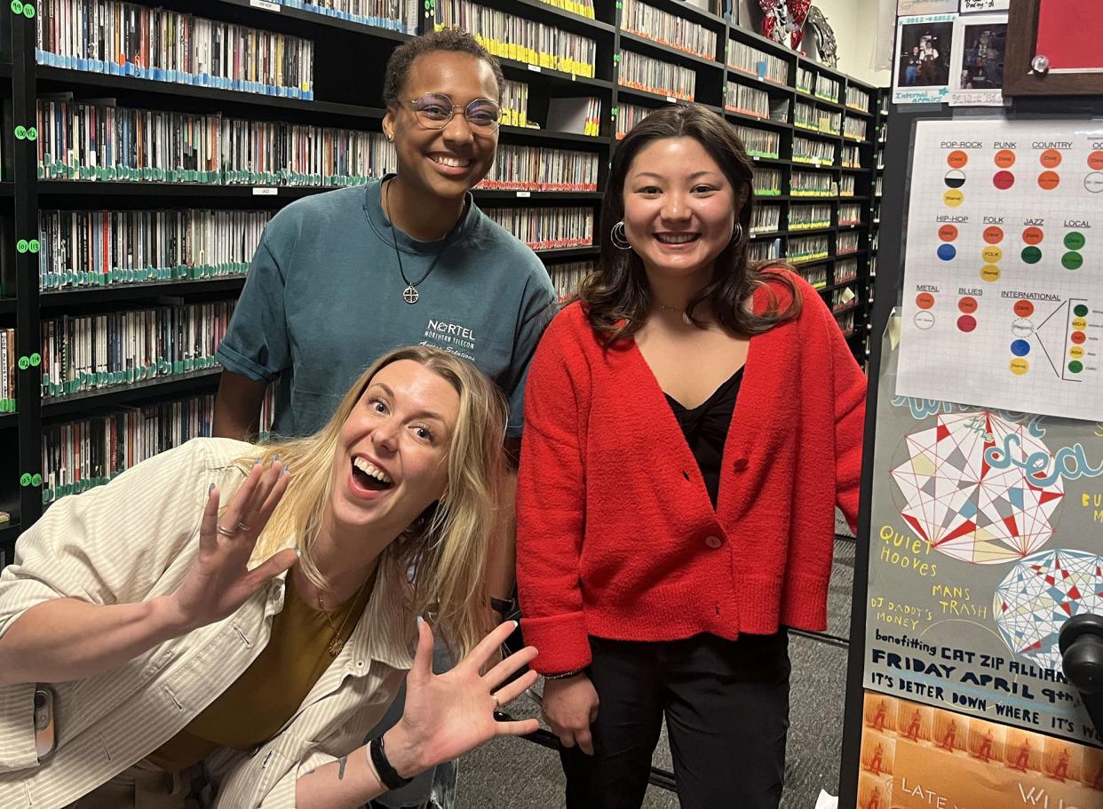 WUOG staff members (top L-R) Mal Holmes and Elizabeth Kim pose with NPR host Raina Douris in Athens, Ga. on March 20, 2024. WUOG is the subject of an episode of the NPR Series "Sense of Place," which begins airing on May 8, 2024.