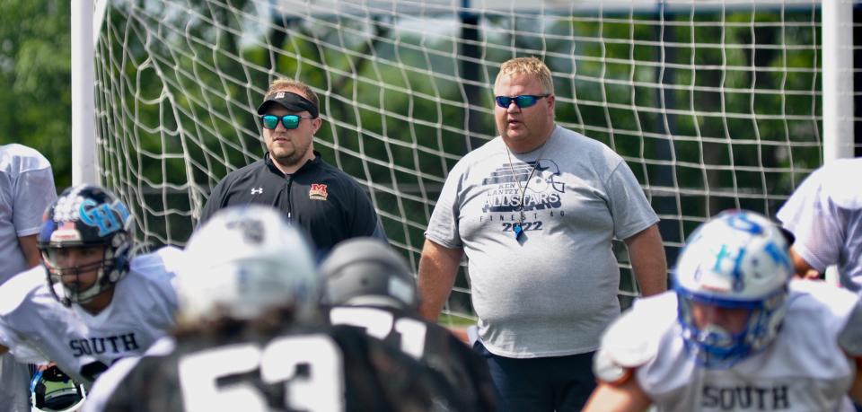 South Team head coach Matt Grohal, right, and assistant Timothy Hornick look on during Ken Lantzy Finest 40 All-Star Classic practice, Monday, at Richland High School.