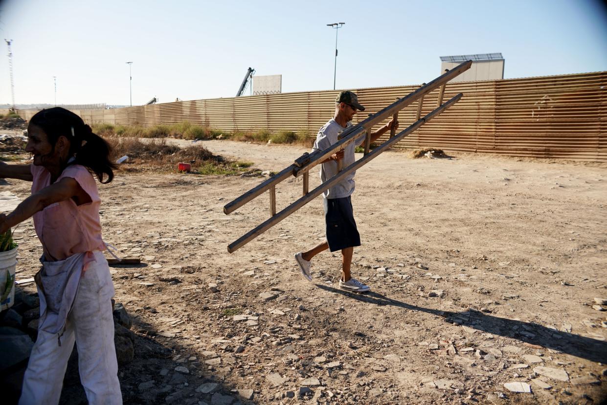 <p>Migrants are reportedly crossing the US-Mexico border wall with $5 ladders</p> (Getty Images)