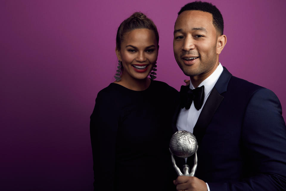 Singer John Legend (R), winner of the President's Award, and TV personality Chrissy Teigen pose for a portrait during the 47th NAACP Image Awards.