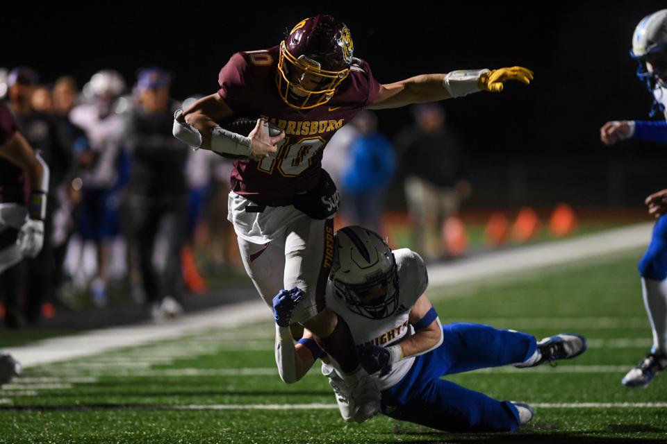 Harrisburg's wide receiver Max Carlson (10) tries to evade an O'Gorman player on Friday, Nov. 3, 2023 at Harrisburg High School in Harrisburg, South Dakota.