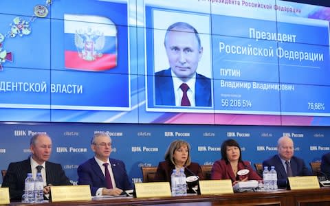 Central electoral commission head Ella Pamfilova, centre, announces the results on Monday - Credit: Sergei Bobylev/TASS via Getty