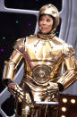 <p>In a surprise move, Gifford wore the clunky C-3PO costume. At least she had Hoda to help her with her wine glass! (Photo: INF Photo) </p>