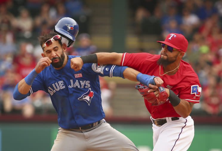 Rougned Odor punches Jose Bautista in the face. (Getty Images/Fort Worth Star-Telegram)