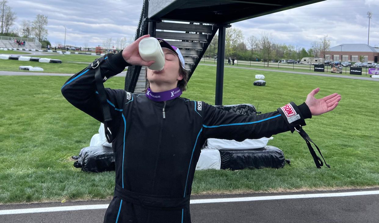 Senior Michael Cruz celebrates winning the 66th Purdue Grand Prix with a bottle of milk on Saturday, April 22, 2023.
