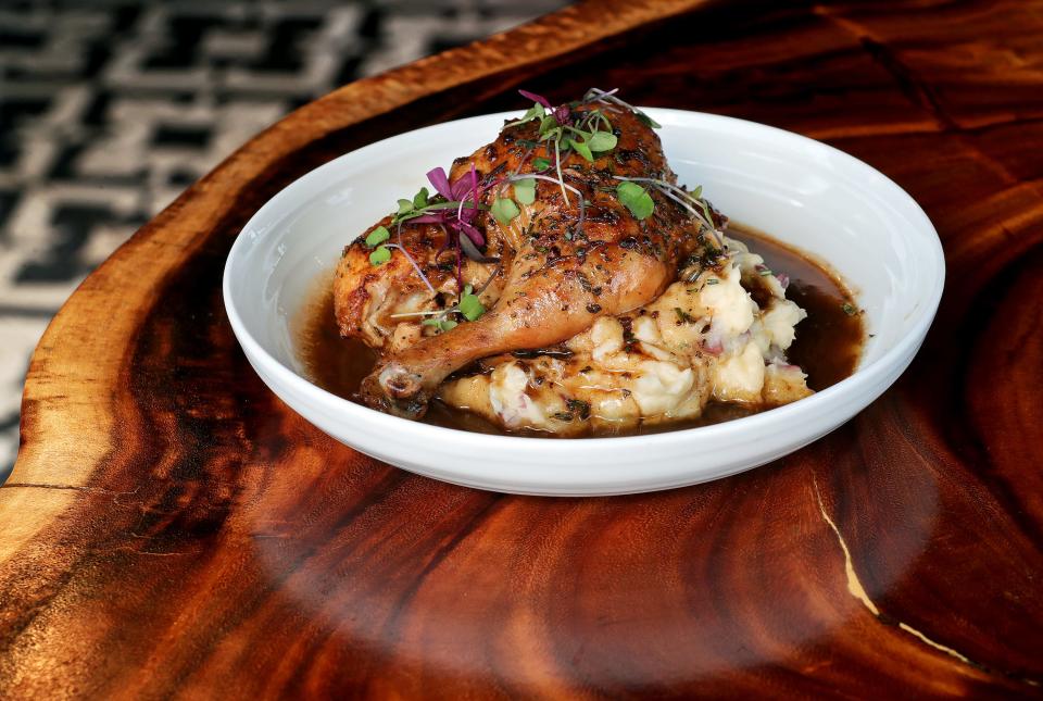Slow-roasted Amish chicken served on a bed of whipped potatoes and pan sauce at Town Tavern Wednesday, Sept. 20, 2023, in Copley, Ohio.