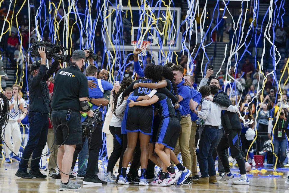 Kentucky players celebrate after beating South Carolina in the NCAA women's college basketball Southeastern Conference tournament championship game Sunday, March 6, 2022, in Nashville, Tenn. Kentucky won 64-62. (AP Photo/Mark Humphrey)