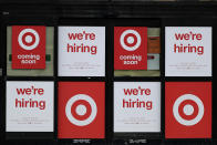 Hiring signs are displayed at a Target store in Chicago, Thursday, May 28, 2020. Thirty-seven major U.S. companies hiring now to meet coronavirus demand. (AP Photo/Nam Y. Huh)