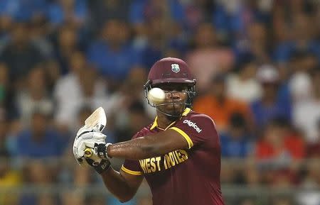 Cricket - West Indies v India - World Twenty20 cricket tournament semi-final - Mumbai, India - 31/03/2016. West Indies Johnson Charles plays a shot. REUTERS/Danish Siddiqui