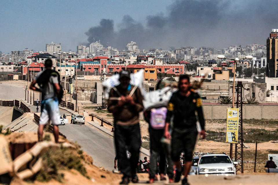 Image: Smoke rises above buildings during Israeli bombardment as people fleeing the Al-Shifa hospital (AFP - Getty Images)