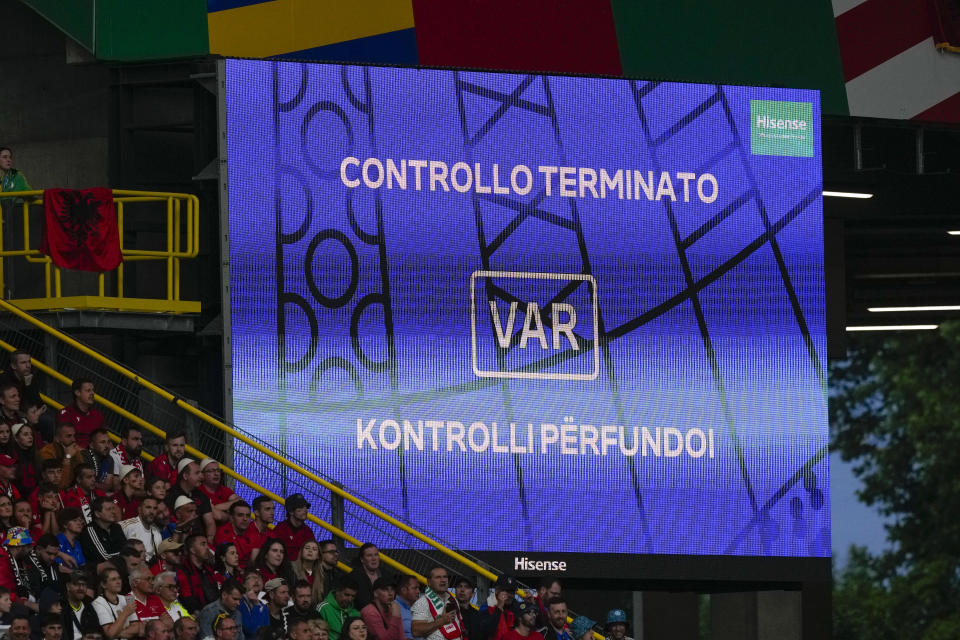 A giant screen displays a VAR review message during a Group B match between Italy and Albania at the Euro 2024 soccer tournament in Dortmund, Germany, Saturday, June 15, 2024. (AP Photo/Frank Augstein)