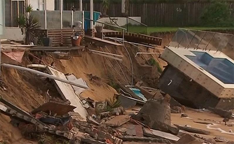 Homes in Collaroy were battered by gale-force winds and rough seas, with forces so strong a swimming pool was dragged out of its holdings. Photo: 7 News