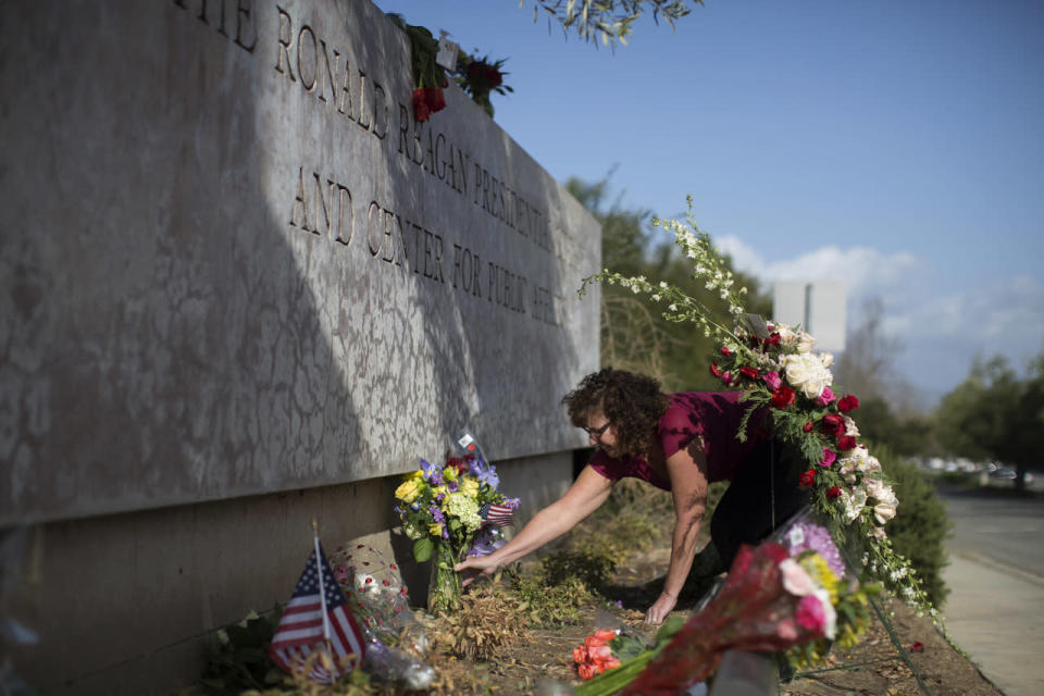 Arranging flowers in memory of Nancy