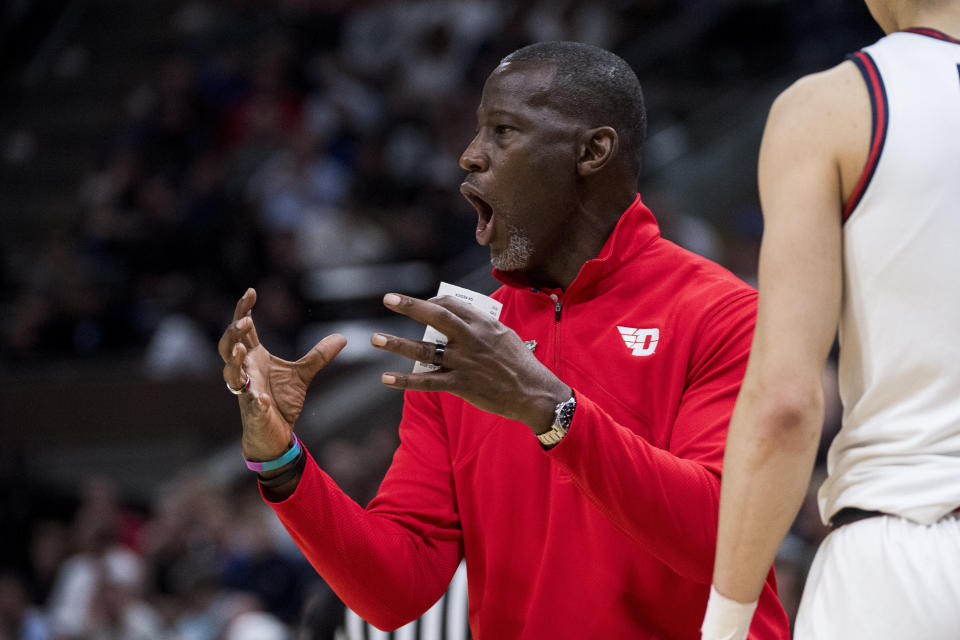 Dayton head coach Anthony Grant talks with his players during the first half of a first-round college basketball game against Nevada in the NCAA Tournament in Salt Lake City, Thursday, March 21, 2024. (AP Photo/Isaac Hale)