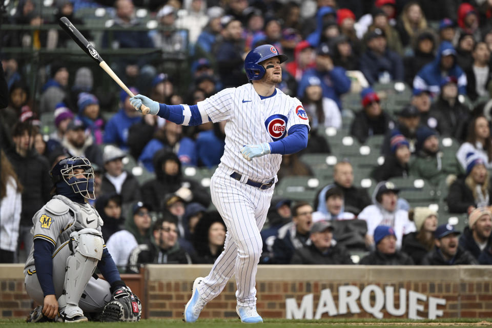 Chicago Cubs Ian Happ (8) hits a home run in during the sixth inning of a baseball game against the Milwaukee Brewers, Saturday, April 1, 2023, in Chicago. (AP Photo/Quinn Harris)