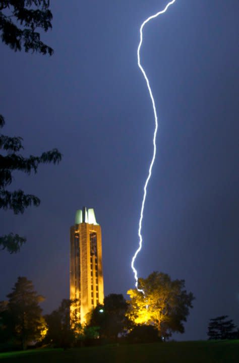 Lightning strikes behind the campanile on the University of Kansas campus in Lawrence, Kan., Wednesday, May 30, 2012. (AP Photo/Orlin Wagner)