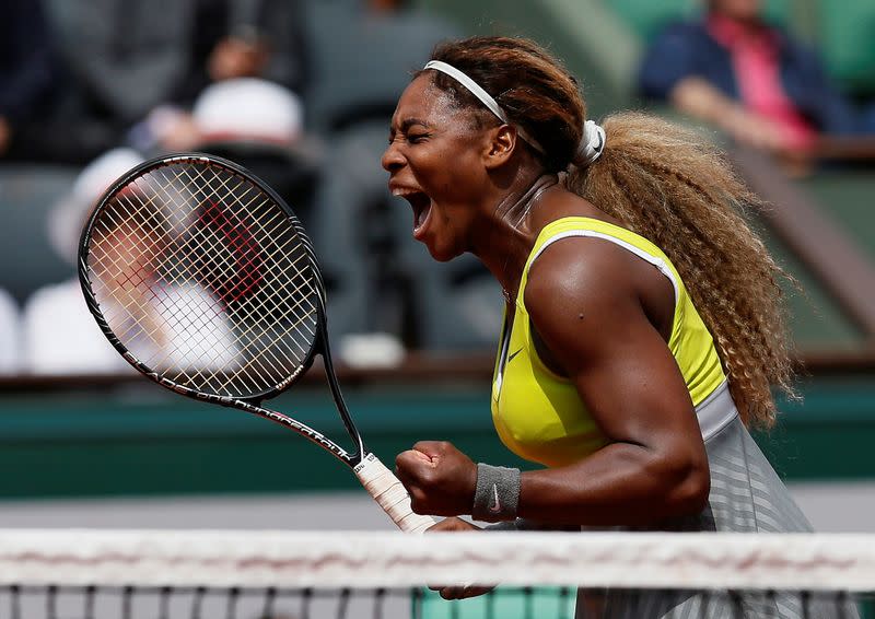 FILE PHOTO: Serena Williams of the U.S celebrates her victory over Alize Lim of France during their women's singles match at the French Open at Roland Garros in Paris.