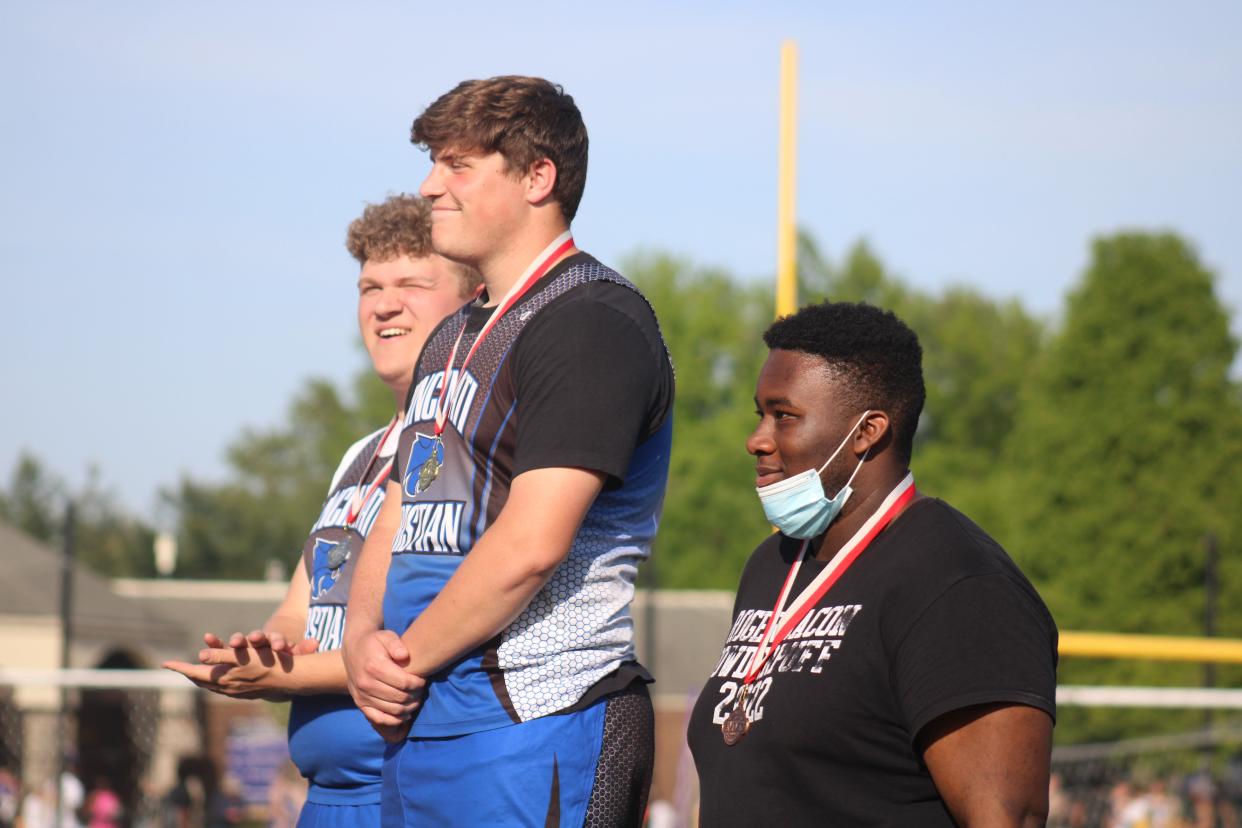 Josh Holder (center) has won two straight Miami Valley Conference shot put titles.