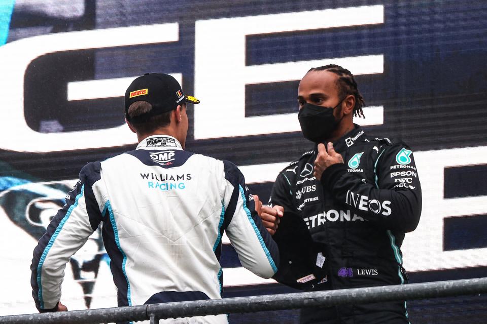 George Russell (left) will be racing alongside Lewis Hamilton next season (AFP via Getty Images)