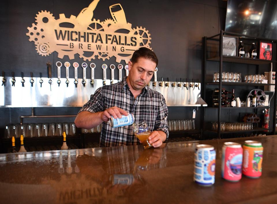 Matt Bitsche, co-owner of Wichita Falls Brewing Company, pours one of the craft beers brewed at his downtown brewery.