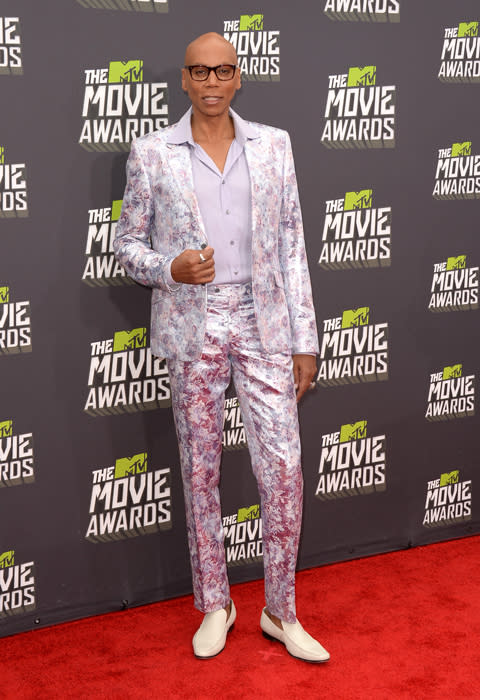 The legendary Rupaul Charles hit the red carpet in a floral suit that was positively demure compared to the usual attire of his drag queen alter ego.