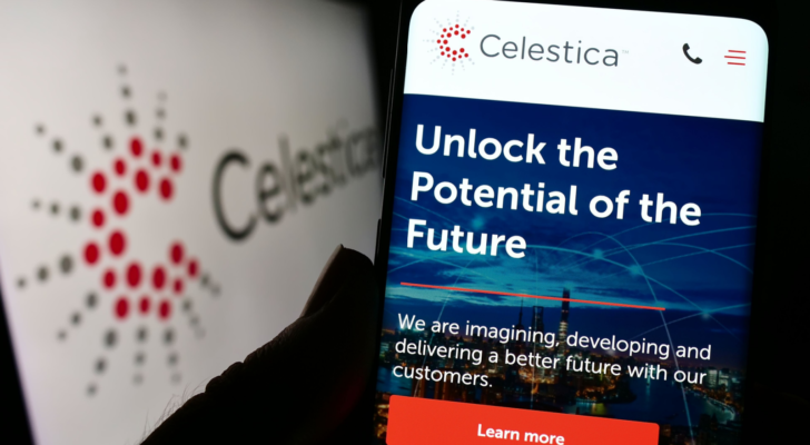 Person holding cellphone with website of Canadian electronics company Celestica Inc. (CLS) on screen in front of logo. Focus on center of phone display. Unmodified photo.