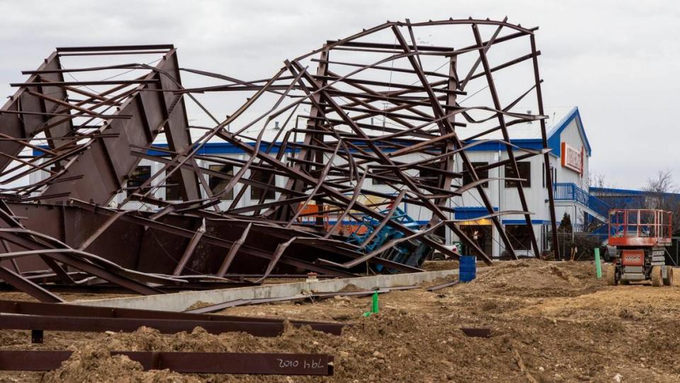 At the construction site where a building collapsed Wednesday near the Boise Airport, wreckage shows twisted girders with a crane in the center. Three workers died at the scene and nine others were injured. The project was an airplane hangar for Jackson Jet Center.