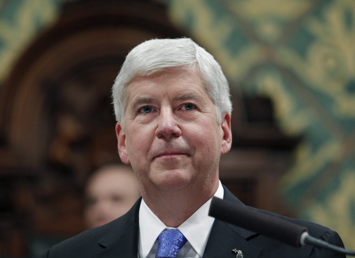 FILE - Then-Michigan Gov. Rick Snyder delivers his State of the State address at the state Capitol in Lansing, Mich., Jan. 23, 2018. A judge dismissed criminal charges against Snyder in the Flint water crisis, months after the state Supreme Court said indictments returned by a one-person grand jury were invalid. (AP Photo/Al Goldis, File)