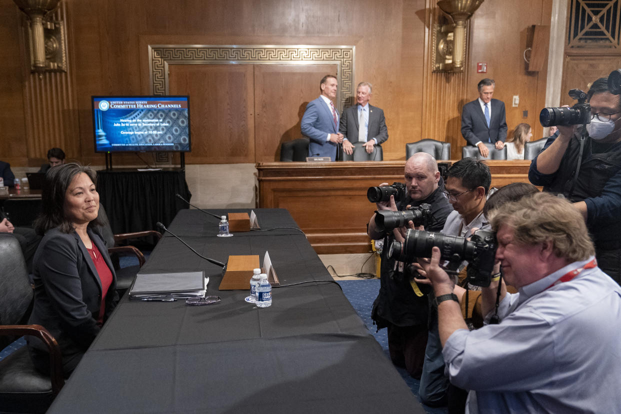 Julie Su, left, is seated for a Senate Health, Education, Labor and Pensions confirmation hearing for her to be the Labor Secretary, on Capitol Hill, Thursday, April 20, 2023, in Washington. (AP Photo/Alex Brandon)