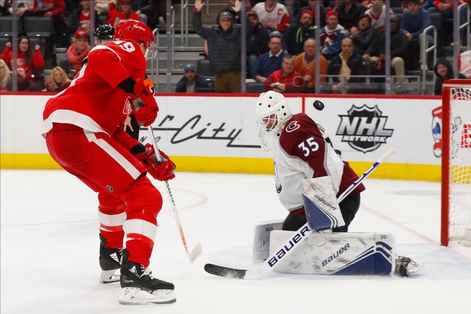 Colorado Avalanche goaltender Michael Hutchinson (35) stops a Detroit Red Wings right wing Anthony Mantha (39) shot in the second period of an NHL hockey game Monday, March 2, 2020, in Detroit. (AP Photo/Paul Sancya)