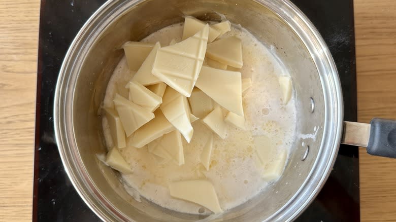 pot of white chocolate chunks in milk