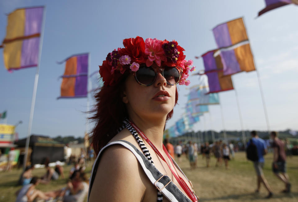 Nicola Deaton, 24, at Glastonbury for her second time, poses for a picture on the first day of Glastonbury music festival at Worthy Farm in Somerset, June 26, 2013. REUTERS/Olivia Harris (BRITAIN - Tags: ENTERTAINMENT FASHION SOCIETY)