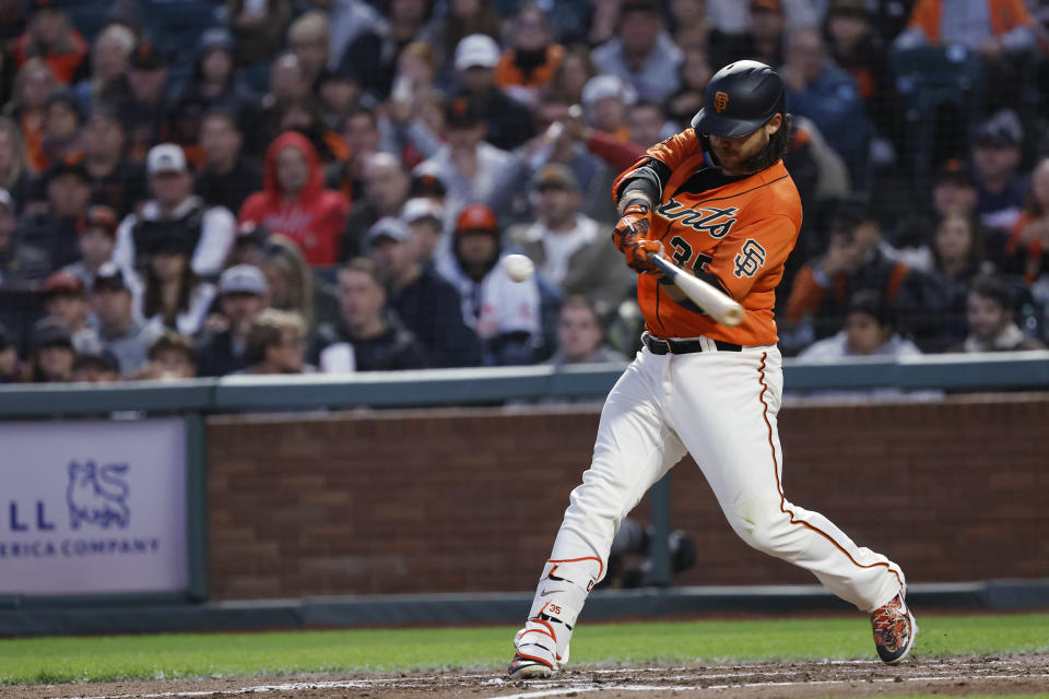 San Francisco Giants' Brandon Crawford hits a two-run home run against the Colorado Rockies during the sixth inning of a baseball game in San Francisco, Friday, July 7, 2023. (AP Photo/Josie Lepe)