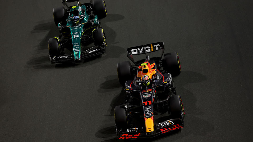 Sergio Perez and Fernando Alonso race.