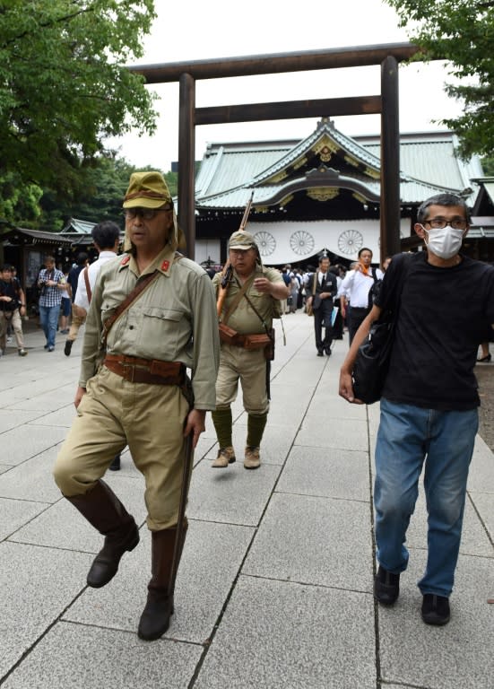 Men dressed in period Japanese Imperial Army uniforms visit controversial Yasukuni shrine