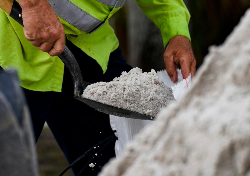 A sand bag is filled at North Collier Regional Park in Naples on Monday, Aug. 28, 2023.