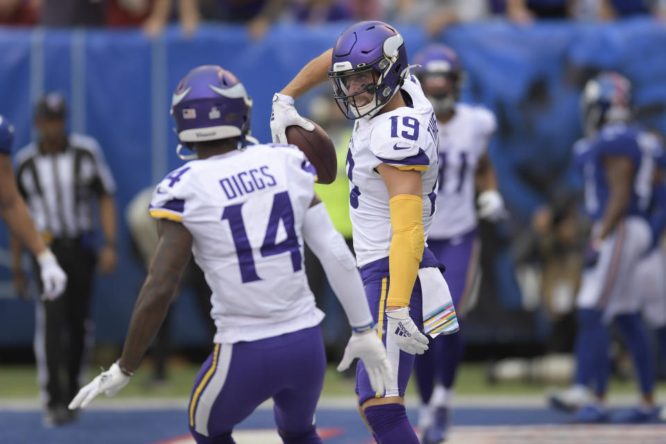 Minnesota Vikings wide receiver Adam Thielen (19) celebrates with wide receiver Stefon Diggs (14) after scoring a touchdown against the New York Giants during the second quarter of an NFL football game, Sunday, Oct. 6, 2019, in East Rutherford, N.J. (AP Photo/Bill Kostroun)