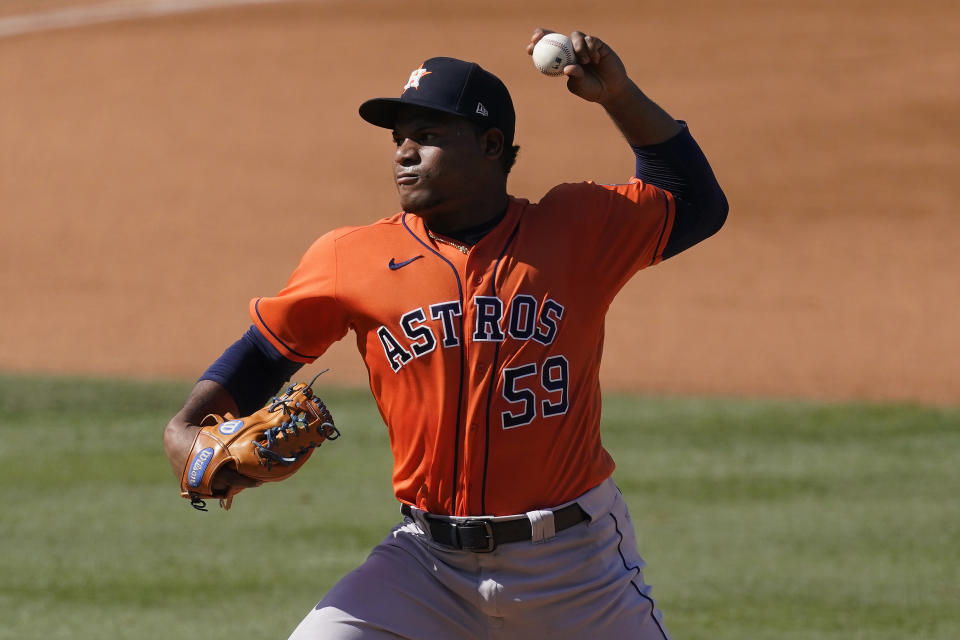 Houston Astros' Framber Valdez (59) pitches against the Oakland Athletics during the fourth inning of Game 2 of a baseball American League Division Series in Los Angeles, Tuesday, Oct. 6, 2020. (AP Photo/Ashley Landis)